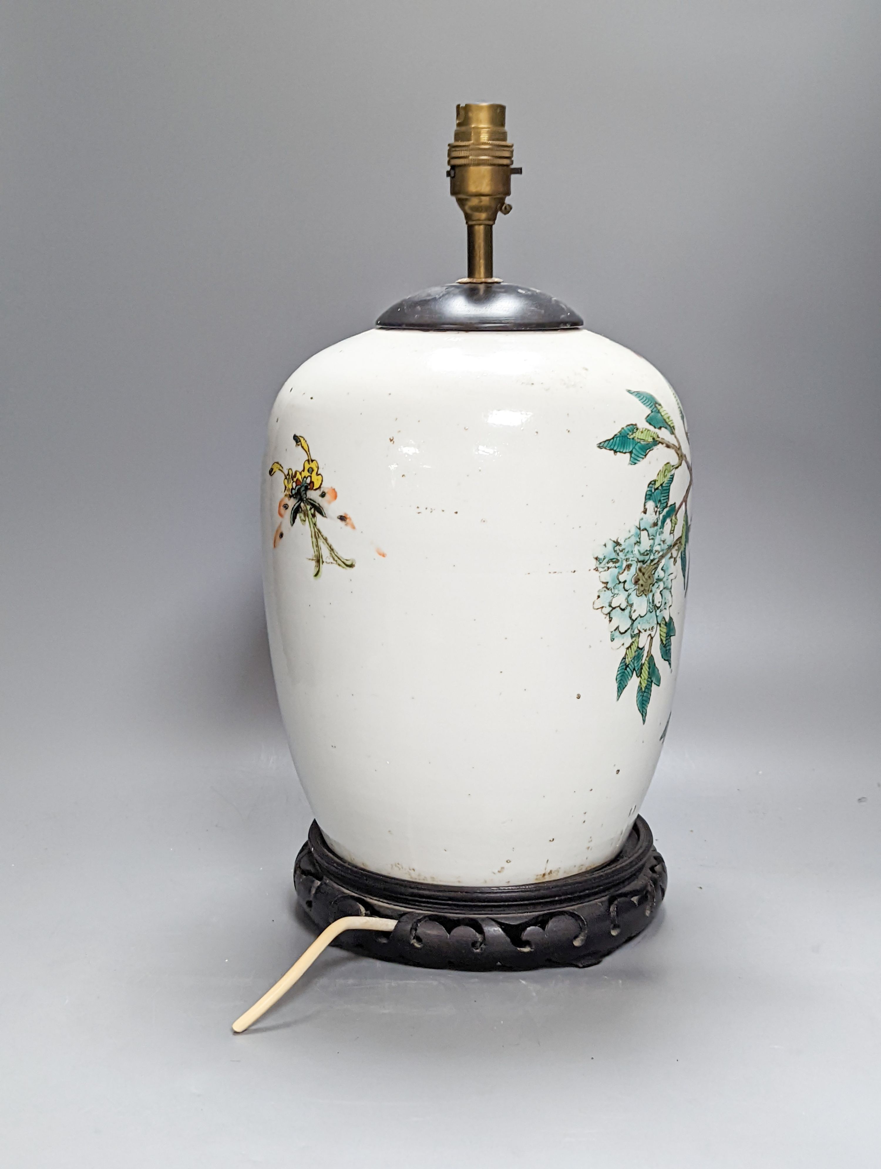 A Chinese famille rose jar now mounted as a lamp, 41 cm high to lamp fitting
